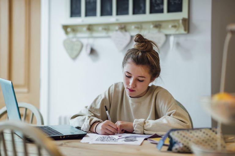 Teenage girl doing homework.
